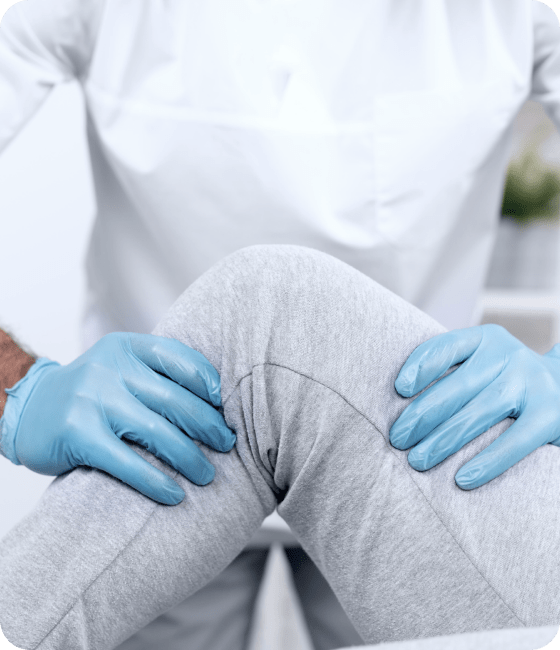 male physiotherapist checking woman s knee mobility 1 1