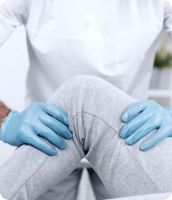 male physiotherapist checking woman s knee mobility 1 1