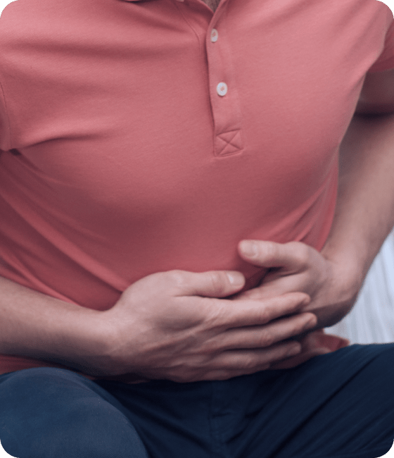 قسم الباطنية والامراض المزمنة 2 people healthcare problem concept unhappy man suffering from stomach ache home 1