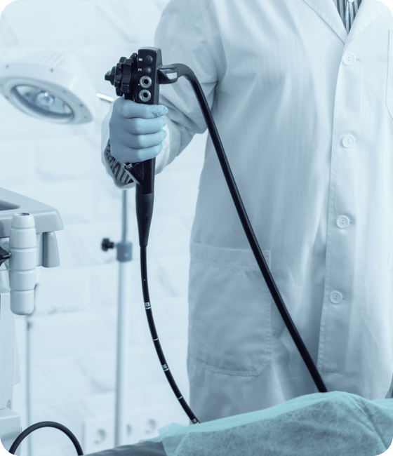 عيادات الجهاز الهضمي والمناظير 2 serious mature doctor holding modern endoscope preparing procedure 1