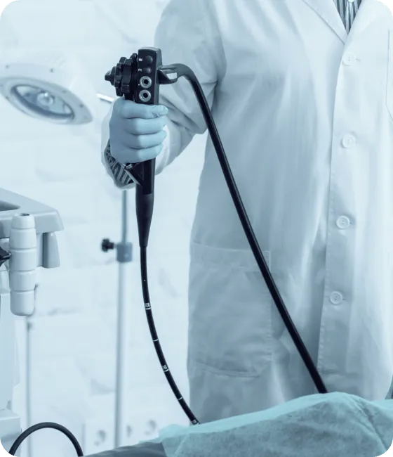 عيادات الجهاز الهضمي والمناظير 2 serious mature doctor holding modern endoscope preparing procedure 1